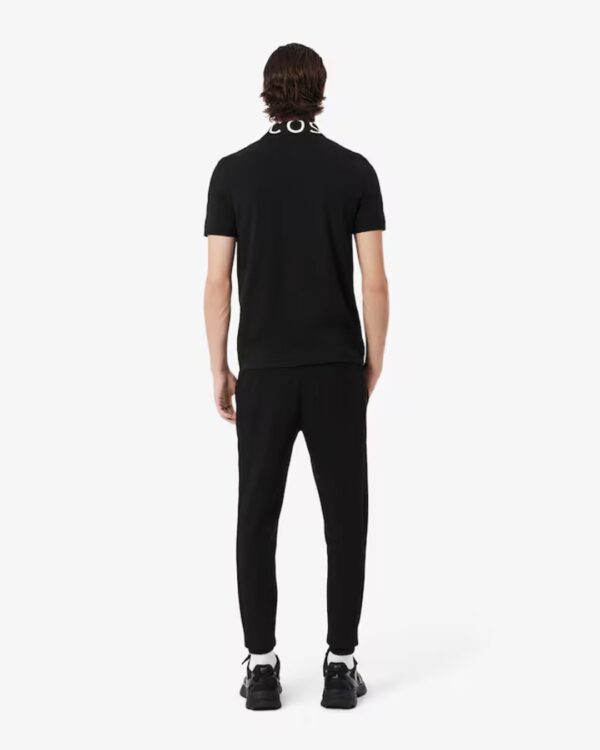 LACOSTEPantalon basico negro